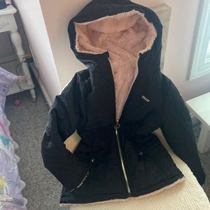 Beautiful DKNY black and light pink coat with 2 pockets and hoodie. Like New.